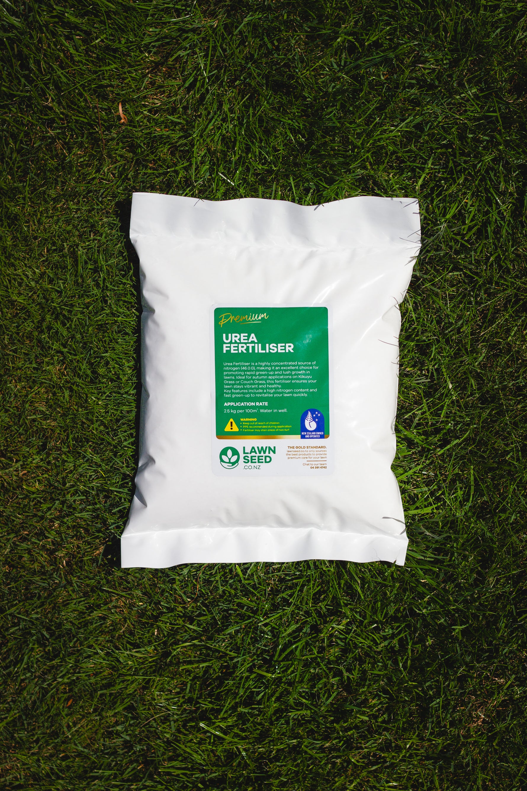 Bag of urea fertilizer on grass